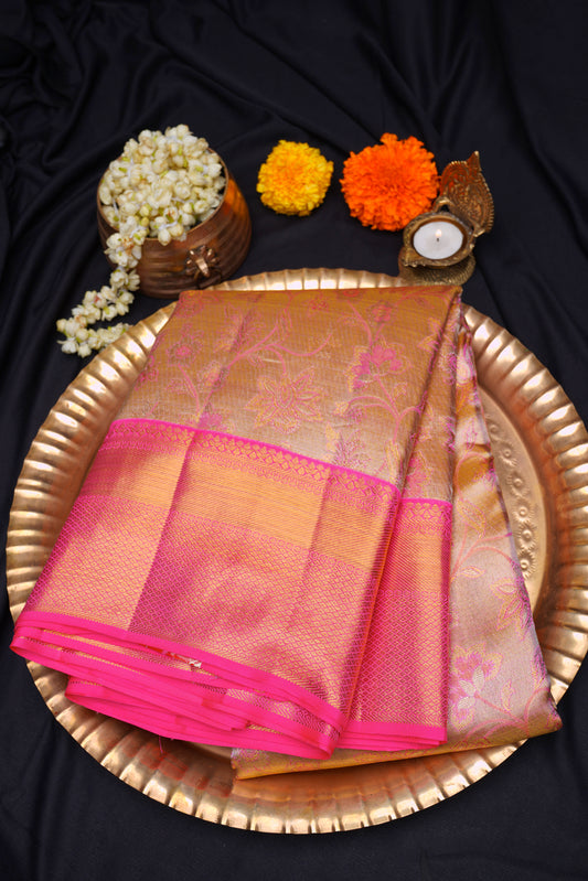Golden kanchipuram saree with fluorescent pink border