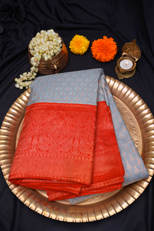 Light blue kanchipuram saree with bright red border