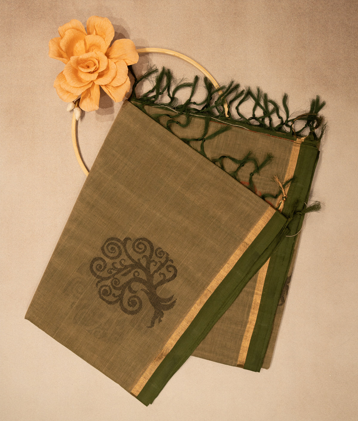 Dull gold saree with gold and olive green boarder